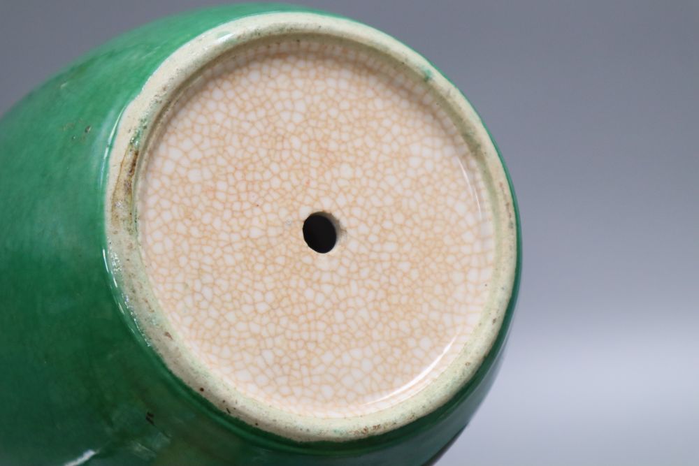 A 19th century Chinese green crackle glaze jar, drilled, wood cover and stand, overall height 25cm